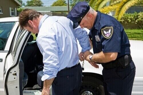 handcuffed man handcuffed man